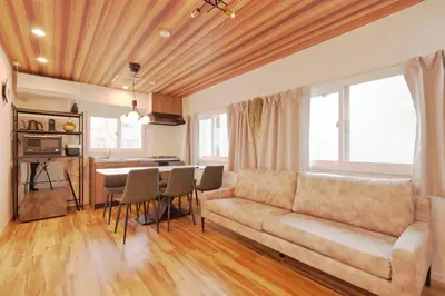 a living room with a couch and a table at V Close to Shinjuku Kabukicho Korean Town FrWIFI L in Tokyo
