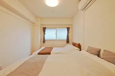 a small bedroom with a bed and a window at V Close to Shinjuku Kabukicho Korean Town FrWIFI L in Tokyo