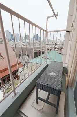 a table on the balcony of a building at V Close to Shinjuku Kabukicho Korean Town FrWIFI L in Tokyo