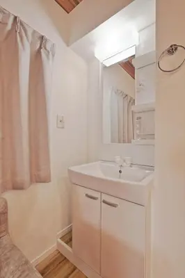 a white bathroom with a sink and a mirror at V Close to Shinjuku Kabukicho Korean Town FrWIFI L in Tokyo