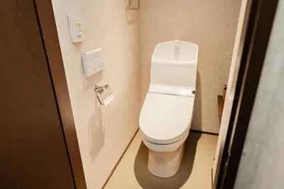a bathroom with a white toilet in a stall at Solvana Akasaka in Tokyo