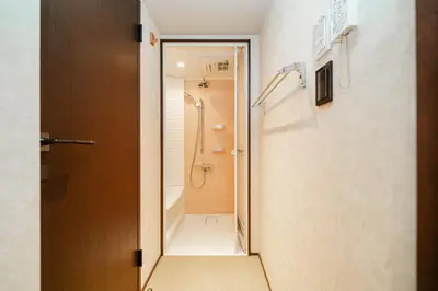 a bathroom with a shower and a walk in shower at Solvana Akasaka in Tokyo