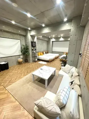 a living room with couches and a white table at \u539f\u7530\u5c4bHotel 3F in Tokyo