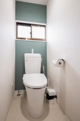a white toilet in a bathroom with a window at Fullhouse 202 in Tokyo