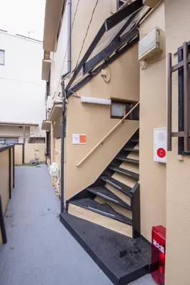 a staircase on the side of a building at Fullhouse 202 in Tokyo