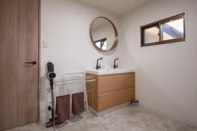 a bathroom with a sink and a mirror at Fullhouse 202 in Tokyo