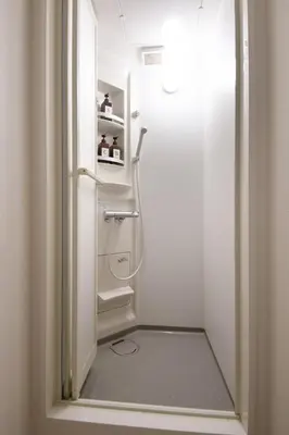 a walk in closet with a white refrigerator at Fullhouse 202 in Tokyo