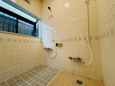 a bathroom with a shower and a window at Lucky you! TATEISHI in Tokyo