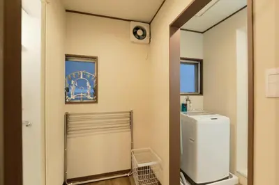 a laundry room with a washer and dryer at ACOE Nakano-Sakaue Holiday Home 5 Minutes to Shinjuku in Tokyo