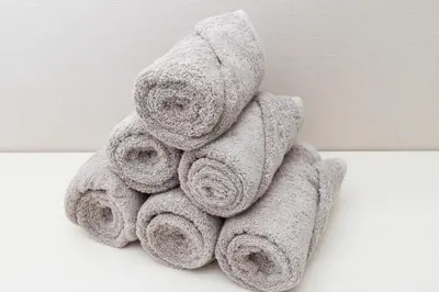 a pile of towels sitting on a table at Latte Oshiage Comfort Stay, 10min walk to Tokyo Skytree in Tokyo