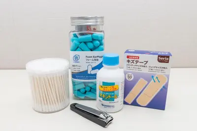 a bottle of medication and a container of blue pills at Latte Oshiage Comfort Stay, 10min walk to Tokyo Skytree in Tokyo