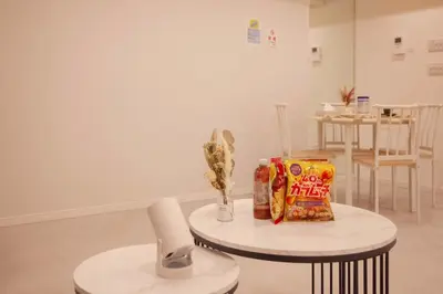 a room with two tables with snacks on it at \u68ee\u4e0b\u5c0f\u5c4b in Tokyo