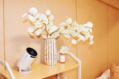 a vase with flowers on a table with a hair dryer at F-Mansion210 in Tokyo