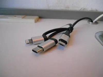 a usb cable sitting on top of a table at Grand Central Hotel in Tokyo