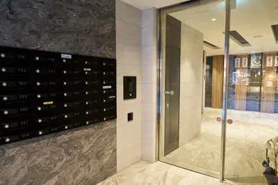 a walk in wine cellar with a glass door at Nomadland Shinagawa Omori 1104 in Tokyo