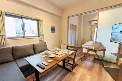 a living room with a couch and a table at Nomadland Shinagawa Omori 1104 in Tokyo