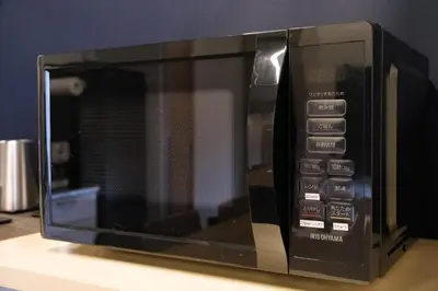 a microwave oven sitting on top of a counter at Stay Chill Shinbashi in Tokyo