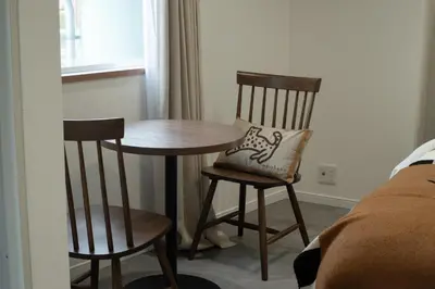 a small table and two chairs in a room at LOFT-Hatsudai hostel\u521d\u53f0SY0362 in Tokyo