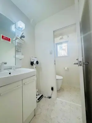 a white bathroom with a sink and a toilet at LOFT-Hatsudai hostel\u521d\u53f0SY0362 in Tokyo