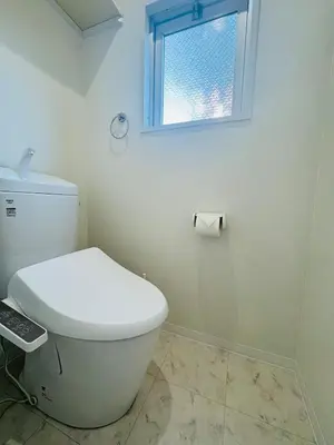 a white bathroom with a toilet and a window at LOFT-Hatsudai hostel\u521d\u53f0SY0362 in Tokyo