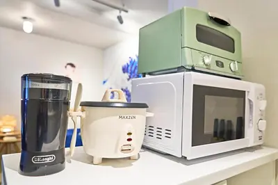 a microwave and a blender on a counter at IZURU Shiba Hamamatsucho 3F in Tokyo