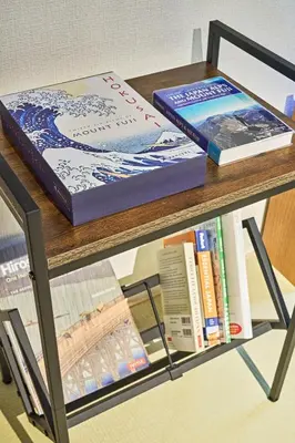 two books are sitting on a table at IZURU Shiba Hamamatsucho 3F in Tokyo