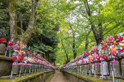 a row of flags on a fence in a park at IZURU Shiba Hamamatsucho 3F in Tokyo