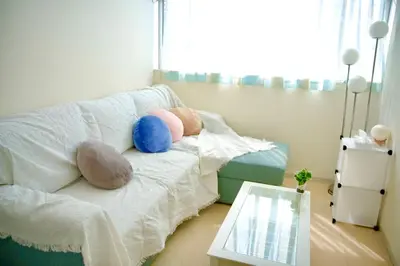 a room with a bed with stuffed animals on it at bicyclettesumida in Tokyo