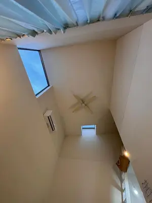 a room with a clock on the ceiling at bicyclettesumida in Tokyo