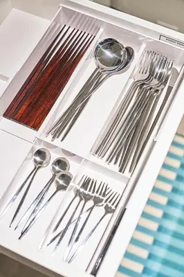 a tray with silver utensils on a table at IZURU Shiba Hamamatsucho 2F in Tokyo