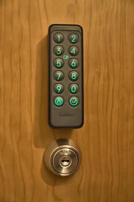 a remote control sitting on top of a wooden table at IZURU Shiba Hamamatsucho 2F in Tokyo