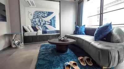 a living room with a couch and a table at LANG HOTEL Asakusa# 3 mins walk to Senso-ji Temple in Tokyo