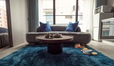 a living room with a couch and a table at LANG HOTEL Asakusa# 3 mins walk to Senso-ji Temple in Tokyo