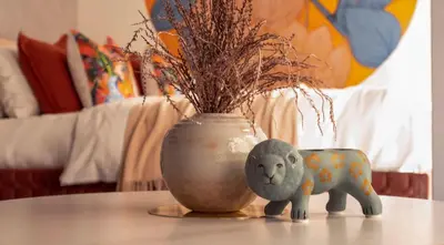 a figurine of an elephant and a vase on a table at LANG HOTEL Asakusa# 3 mins walk to Senso-ji Temple in Tokyo