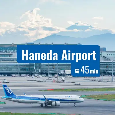 an airplane is sitting on the runway at an airport at NEW Renovated Traditional Japanese House in Sumida in Tokyo