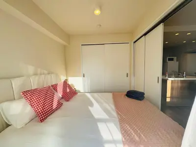 a bedroom with a bed with two pillows on it at Kabukichō, Shinjuku City -13F-SJ0019 in Tokyo