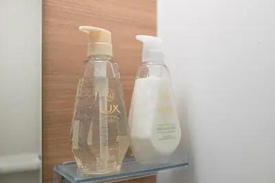 two bottles of soap and milk on a shelf at Horizon Court Shinjuku in Tokyo