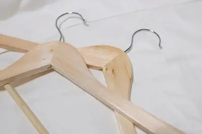 a wooden chair with two handles on a wall at Horizon Court Shinjuku in Tokyo