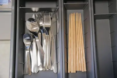 a drawer with silver utensils in a refrigerator at Cozy Nest Sangenjaya 1 Stop to Shibuya \u30fcWalk to Sangenjaya and Ikejiri in Tokyo