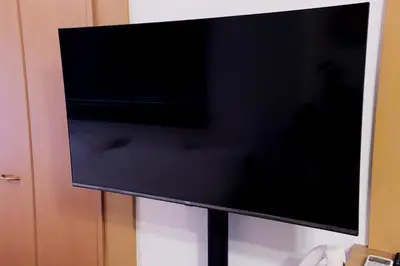 a flat screen tv sitting on a wall at Cozy Nest Sangenjaya 1 Stop to Shibuya \u30fcWalk to Sangenjaya and Ikejiri in Tokyo
