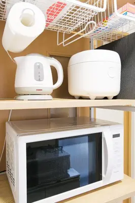 a microwave oven and a printer on a shelf at Cozy Nest Sangenjaya 1 Stop to Shibuya \u30fcWalk to Sangenjaya and Ikejiri in Tokyo