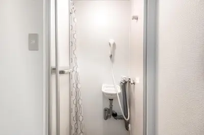 a small bathroom with a toilet and a shower at \u53f0\u67713\u4e01\u76ee\u6238\u5efa in Tokyo