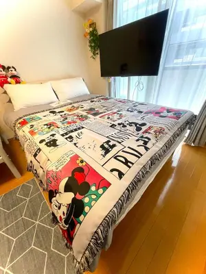 a bedroom with a bed with a hello kitty blanket at sitamachi Shin-Koiwa 302 in Tokyo