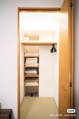 a closet with a door open with papers at sitamachi Shin-Koiwa 302 in Tokyo