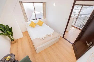 a small room with a bed and a window at Akabanestay A \u5fd7\u8302 in Tokyo