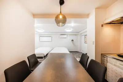 a conference room with a long table and chairs at R101-Shinjuku 13 minUp to 8 people 60 sqmFull renovationRoppongi and Tsukiji direct accessFamily group7 min to Ochiai Minami-Nagasaki Station in Tokyo