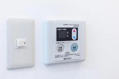 an electronic device is attached to a wall at R101-Shinjuku 13 minUp to 8 people 60 sqmFull renovationRoppongi and Tsukiji direct accessFamily group7 min to Ochiai Minami-Nagasaki Station in Tokyo