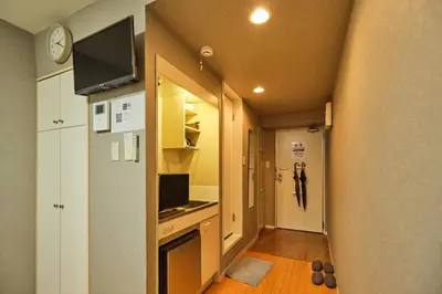a small kitchen with a sink and a refrigerator at \u65b0\u5bbf\u533a\u6b4c\u821e\u4f0e\u753a\u5f92\u6b65\u4f0a\u52bf\u4e39\u54e5\u65af\u62c9\u623f\u6e9004 in Tokyo