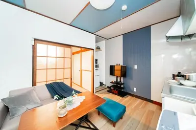 a living room with a table and a couch at Japanese Traditional Villa 8ppl 5min to ST in Tokyo