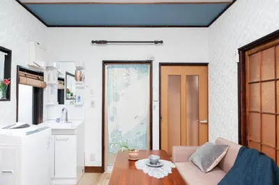 a living room with a couch and a table at Japanese Traditional Villa 8ppl 5min to ST in Tokyo